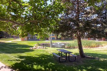 Landscaped courtyards and ponds with outdoor seating
